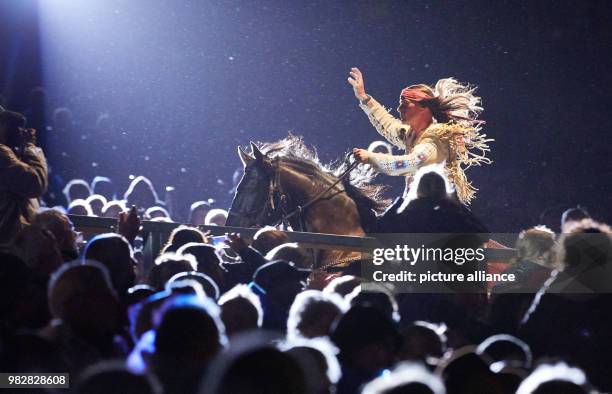 June 2018, Germany, Bad Segeberg: The actor Jan Sosniok as Winnetou riding a horse through the spectator terraces at the premiere of 'Winnetou und...