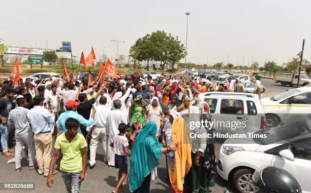 Villagers and residents protest against the dumping ground at sector 123, on June 24, 2018 in Noida, India. The National Green Tribunal issued an...