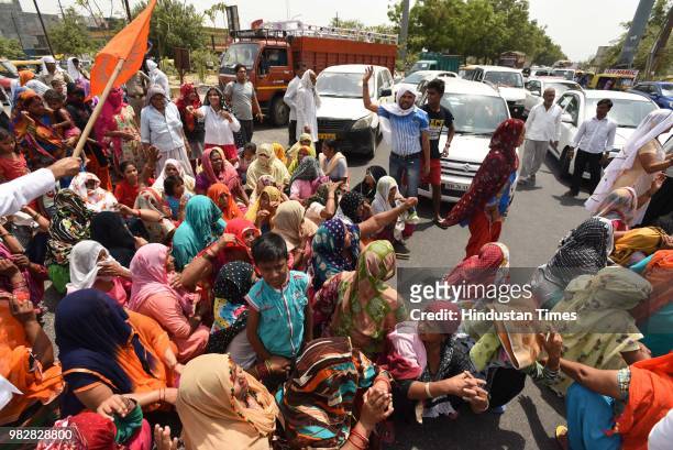 Villagers and residents protest against the dumping ground at sector 123, on June 24, 2018 in Noida, India. The National Green Tribunal issued an...