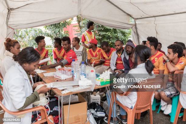 Supporters of Ethiopia's St. George Football Club, one of Addis Ababa's largest football team, arrive to donate blood at Ethiopia Red Cross in Addis...