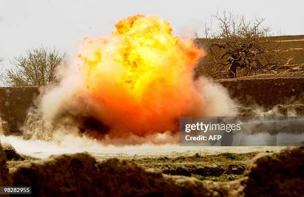 An improvised explosive device explodes in a controlled detonation in Yosef Khel district of Paktika province on April 2, 2010. Afghan National...