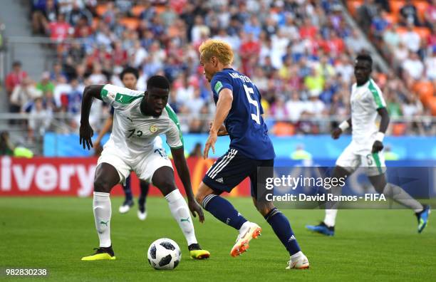 Yuto Nagatomo of Japan takes on Alfred Ndiaye of Senegal during the 2018 FIFA World Cup Russia group H match between Japan and Senegal at...