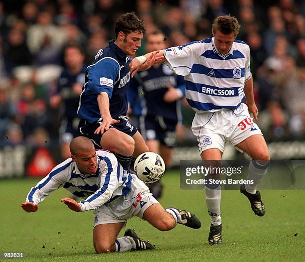 Jason Koumas of Tranmere is tackled by Marcus Bignot and Paul Bruce of QPR during the Queens Park Rangers v Tranmere Rovers Nationwide First Division...