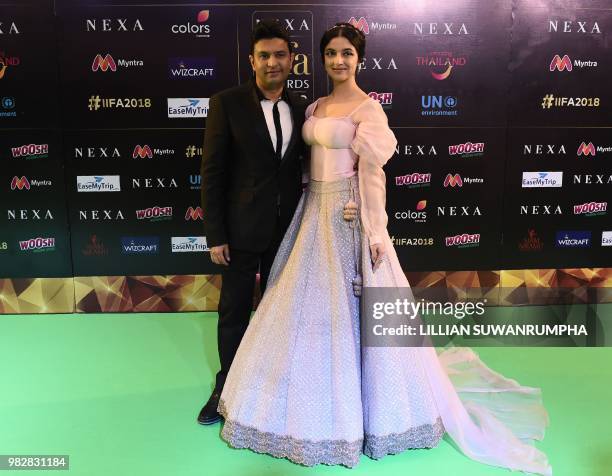 Bollywood prodcer Bhushan Kumar and actress Divya Khosla Kumar arrive for the IIFA Awards of the 19th International Indian Film Academy festival at...
