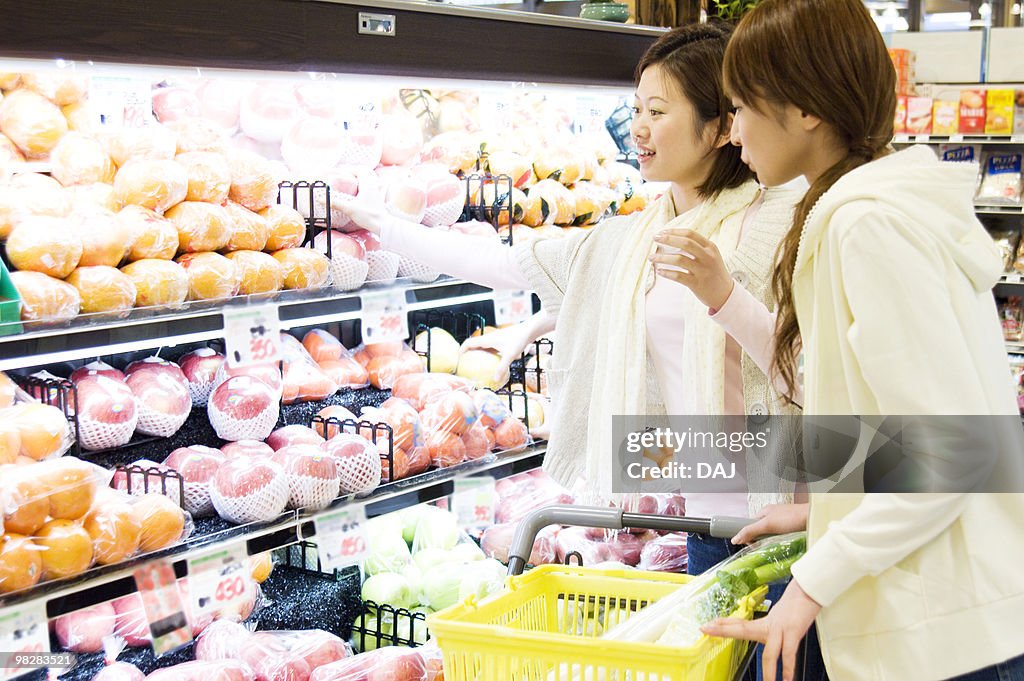 Young women grocery shopping