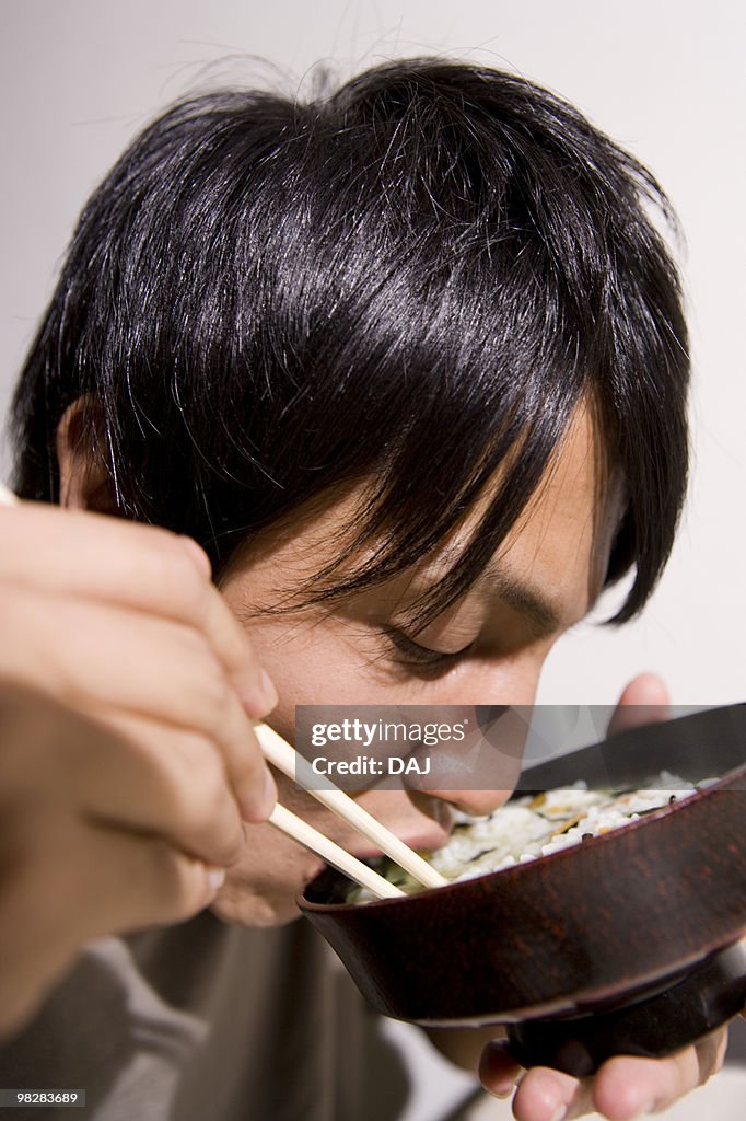 Young man eating ochazuke