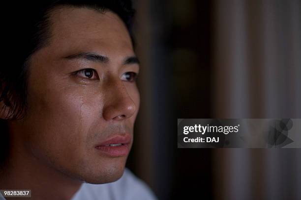 mid adult man crying - man crying tears stock pictures, royalty-free photos & images