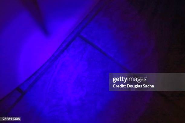 uv black-light illuminating the glowing urine - electron stock pictures, royalty-free photos & images