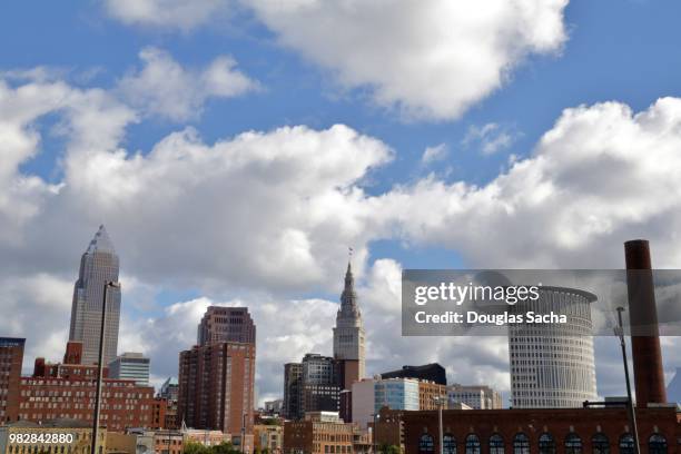 spring time sky over cleveland skyline - cleveland ohio flats stock pictures, royalty-free photos & images