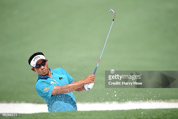 Thongchai Jaidee of Thailand plays a bunker shot during a practice round prior to the 2010 Masters Tournament at Augusta National Golf Club on April...