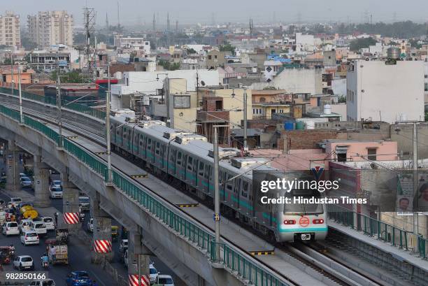 View of Delhi Metro's newly inaugurated Green Line Metro which opened for commuters travelling from Mundka to City Park Metro Station, on June 24,...