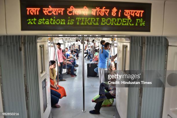 Passengers commute in Delhi Metro's newly opened Green Line Metro from Mundka to City Park Metro Station, on June 24, 2018 in New Delhi, India. The...