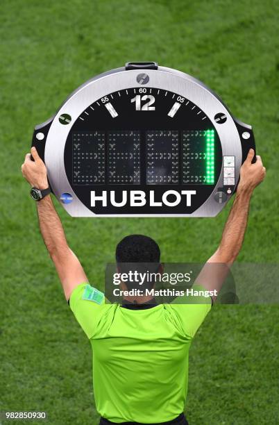 Fourth Official Abdulrahman Al Jassim uses the LED board to show 1 minute of added time at the end of the second half during the 2018 FIFA World Cup...