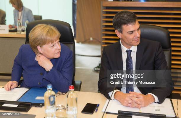 German Chancellor Angela Merkel talks with the Spanish Prime Minister Pedro Sanchez prior an informal working meeting on migration and asylum issues...