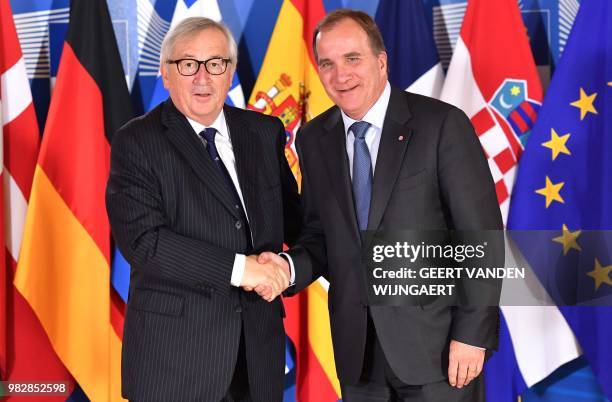 European Commission President Jean-Claude Juncker greets Swedish Prime Minister Stefan Lofven during an informal EU summit on migration issues at EU...