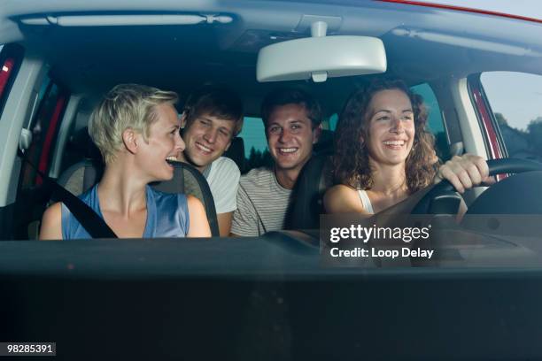 germany, bavaria, young people driving car, smiling, portrait - four friends in car stock pictures, royalty-free photos & images