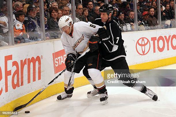 Teemu Selanne of the Anaheim Ducks skates with the puck against Rob Scuderi of the Los Angeles Kings on April 3, 2010 at Staples Center in Los...