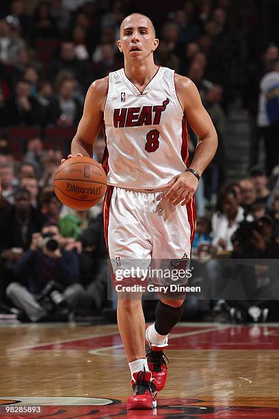 Carlos Arroyo of the Miami Heat brings the ball upcourt against the Chicago Bulls during the game on March 25, 2010 at the United Center in Chicago,...