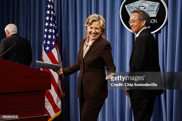 Secretary of State Hillary Clinton and Energy Secretary Steven Chu share a laugh with a reporter after a news briefing about the new Nuclear Posture...