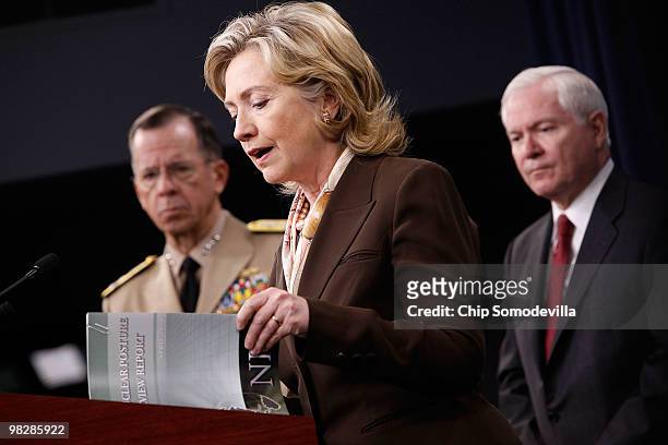 Secretary of State Hillary Clinton reads from the new Nuclear Posture Review during a news briefing with Chairman of the Joint Chiefs of Staff Navy...