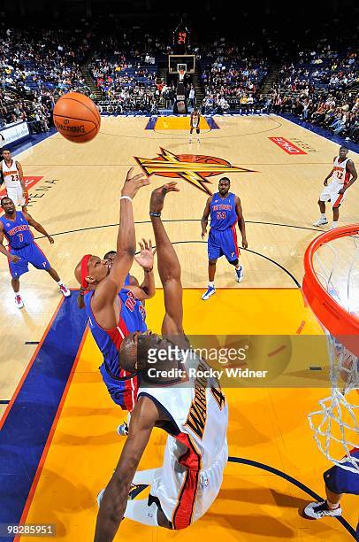 Charlie Villanueva of the Detroit Pistons and Anthony Tolliver of the Golden State Warriors reach for a rebound during the game on February 27, 2009...