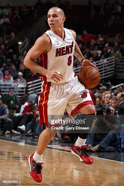 Carlos Arroyo of the Miami Heat handles the ball against the Chicago Bulls during the game on March 25, 2010 at the United Center in Chicago,...