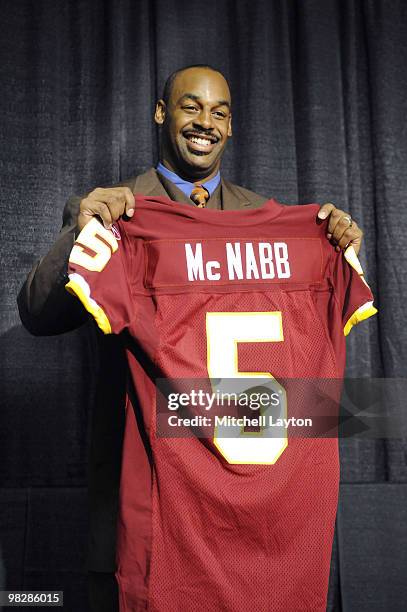 Donovan McNabb of the Washington Redskins displays his new jersey during a press conference on April 6, 2010 at Redskin Park in Ashburn, Virginia.