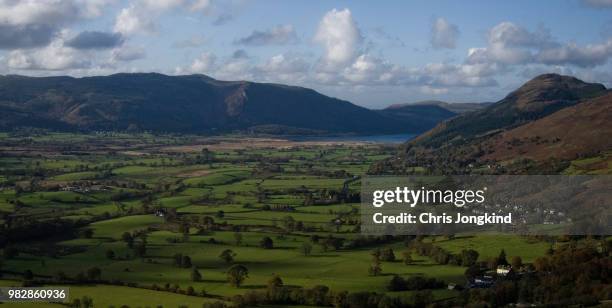 green farmland in a mountainous landscape - keswick stock pictures, royalty-free photos & images