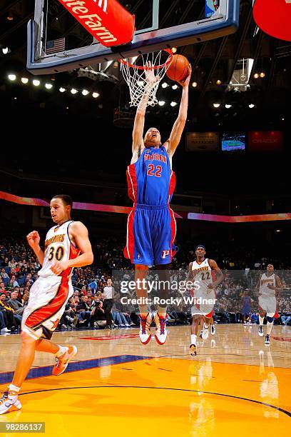 Tayshaun Prince of the Detroit Pistons goes to the basket over Stephen Curry of the Golden State Warriors during the game on February 27, 2009 at...