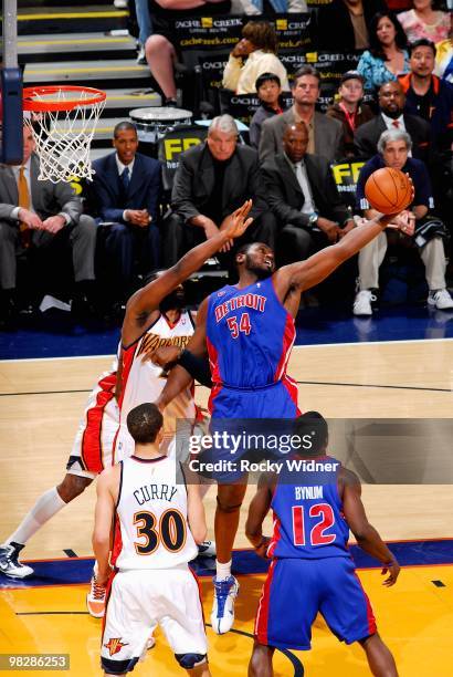 Jason Maxiell of the Detroit Pistons grabs a rebound over Ronny Turiaf of the Golden State Warriors during the game on February 27, 2009 at Oracle...