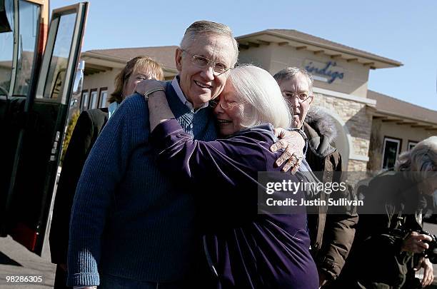 Senate Majority Leader Harry Reid is hugged by a supporter while visiting the 88 Cups coffee shop April 6, 2010 in Minden, Nevada. Sen. Reid...