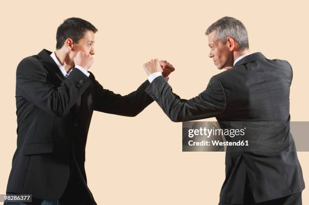 kung fu, sanda, gedou shi, two businessmen fighting - fighting stance stock pictures, royalty-free photos & images