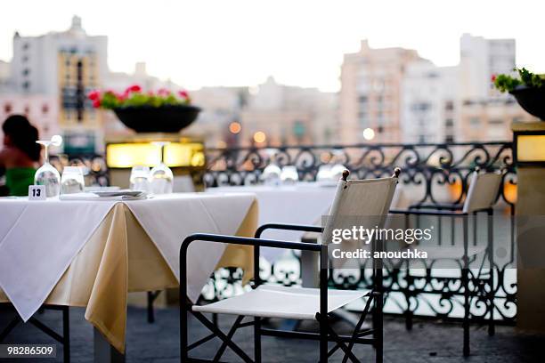 maltese outdoor restaurant in the evening - st julians bay stock pictures, royalty-free photos & images