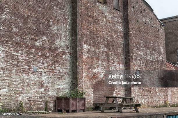 facade of an old factory hall - brick building exterior stock pictures, royalty-free photos & images