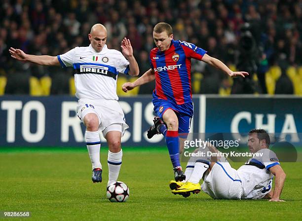 Pavel Mamaev of CSKA Moscow battles for the ball with Esteban Cambiasso of FC Internazionale Milano during the UEFA Champions League Quarter Finals,...