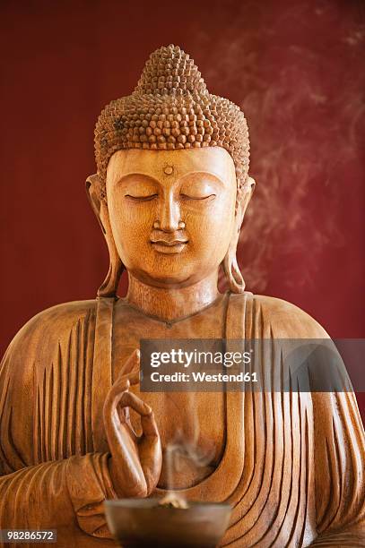 buddha statue and a bowl with joss sticks - buddha bowl stock pictures, royalty-free photos & images
