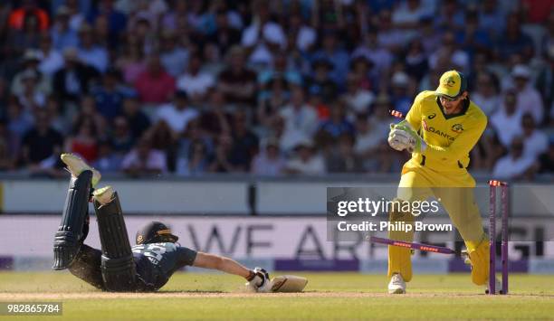 Jos Buttler of England dives for his ground as Tim Paine of Australia breaks the stumps during the fifth Royal London One-Day International match...