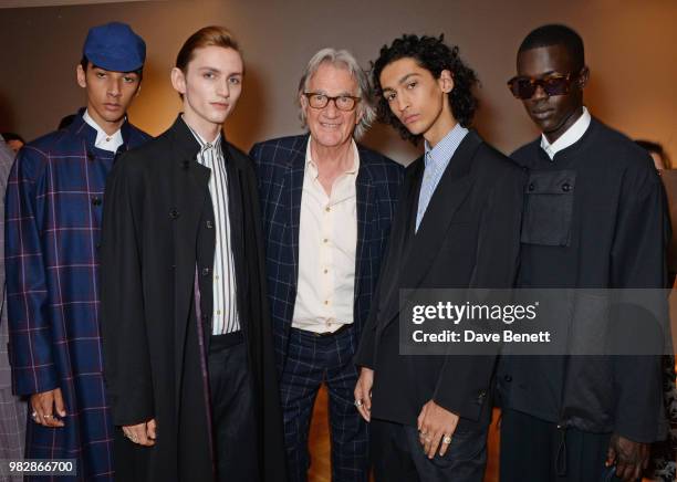 Sir Paul Smith poses with models backstage at the Paul Smith SS19 Menswear Show during Paris Fashion Week at Elysee Montmartre on June 24, 2018 in...