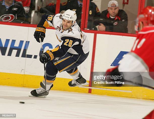 Paul Gaustad of the Buffalo Sabres takes shot on net during the NHL game against the Carolina Hurricanes on March 21, 2010 at the RBC Center in...