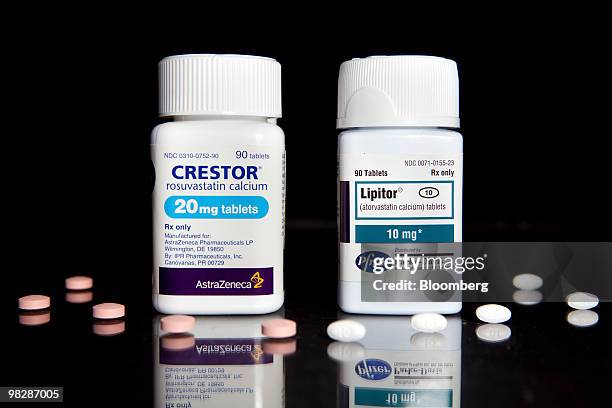 Cholesterol drugs, Crestor, left, manufactured by AstraZeneca Plc, and Lipitor, manufactured by Pfizer Inc., are arranged for a photrograph at New...