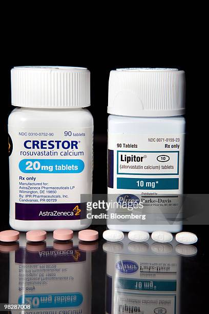 Cholesterol drugs, Crestor, left, manufactured by AstraZeneca Plc, and Lipitor, manufactured by Pfizer Inc., are arranged for a photrograph at New...