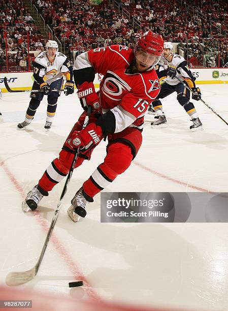 Tuomo Ruutu of the Carolina Hurricanes skates with the puck inside the defensive zone of the Buffalo Sabres during the NHL game on March 21, 2010 at...