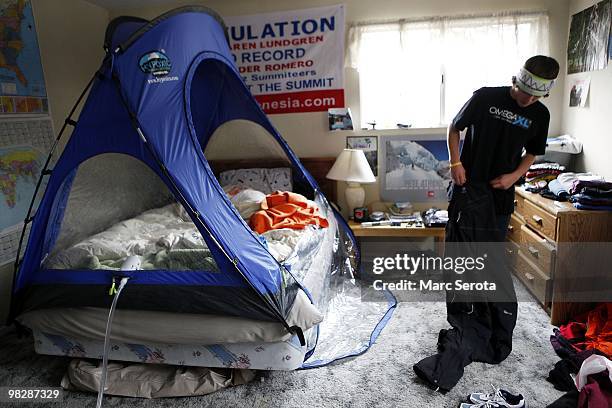 Jordan Romero gets dressed in his room next to the oxygen tent he sleeps in at his home in Big Bear Lake, California on April 6, 2010. Jordan Romero...
