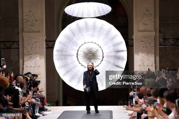 Stylist Yohji Yamamoto salutes the guests on the runway during the Y-3 Menswear Spring/Summer 2019 show as part of Paris Fashion Week on June 24,...