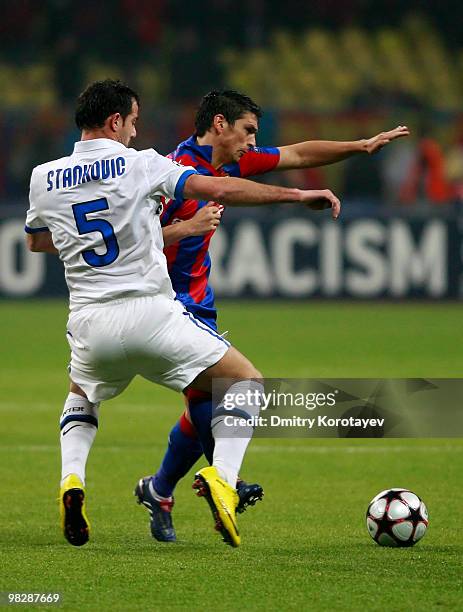 Mark Gonzalez of CSKA Moscow battles for the ball with Dejan Stankovic of FC Internazionale Milano during the UEFA Champions League Quarter Finals,...