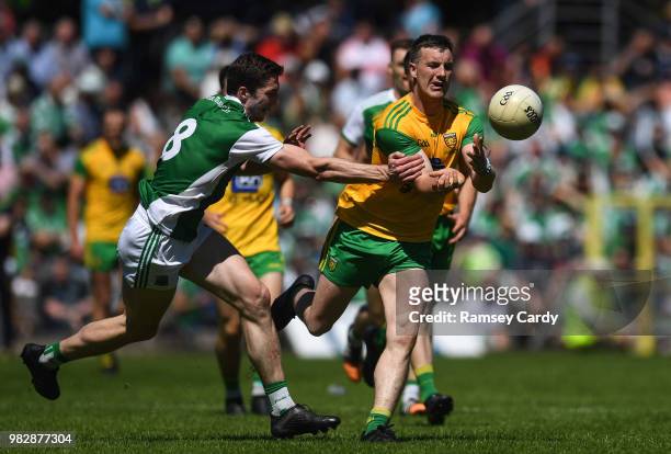 Monaghan , Ireland - 24 June 2018; Leo McLoone of Donegal in action against Eoin Donnelly of Fermanagh during the Ulster GAA Football Senior...