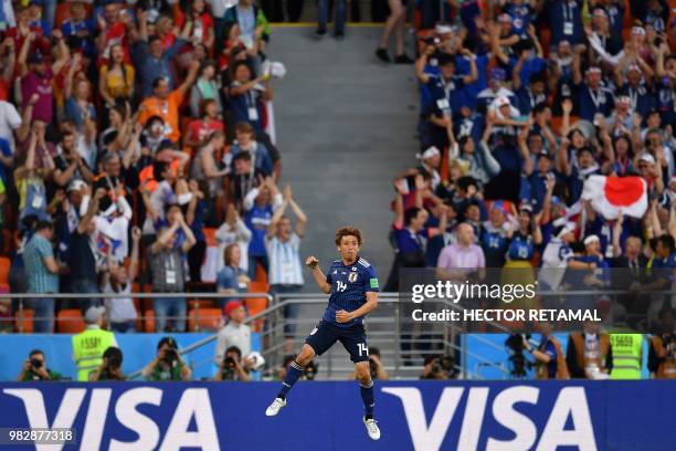 Japan's midfielder Takashi Inui celebrates after scoring a goal during the Russia 2018 World Cup Group H football match between Japan and Senegal at...