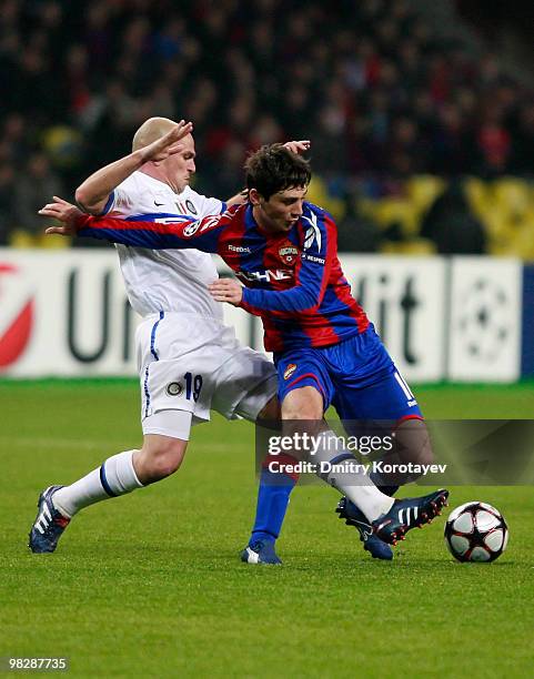 Alan Dzagoev of CSKA Moscow battles for the ball with Esteban Cambiasso of FC Internazionale Milano during the UEFA Champions League Quarter Finals,...