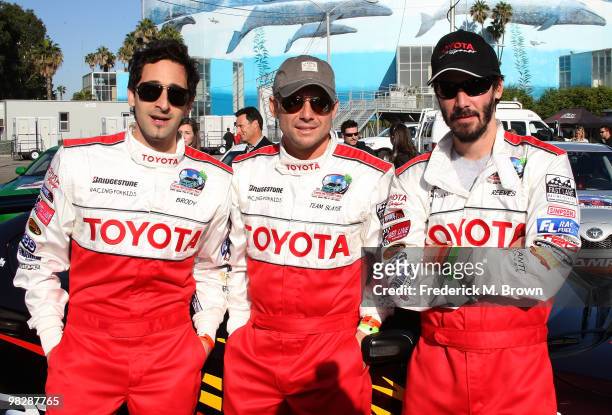 Actors Adrien Brody, Christian Slater and Keanu Reeves pose for photographers during the press practice day for the Toyota Pro/Celebrity Race on...