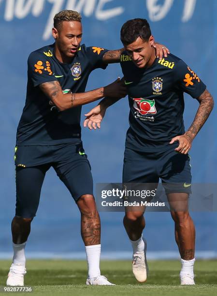 Neymar Jr jokes with Phillipe Coutinho during a Brazil training session at Yug-Sport Stadium on June 24, 2018 in Sochi, Russia.